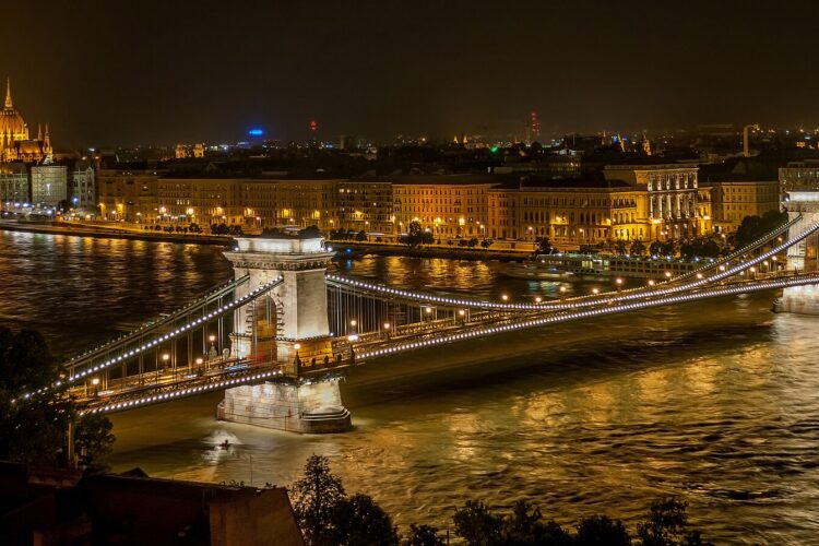 Picture of the Budapest chain bridge and parliament building at night.