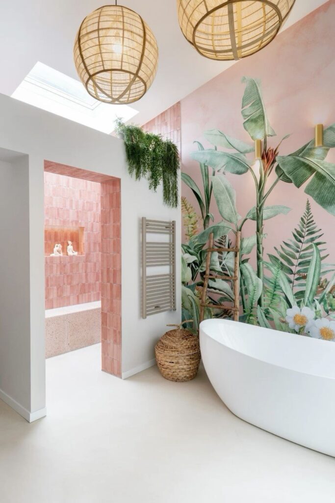 Picture of a bathroom with pink biophilic wallpaper. 