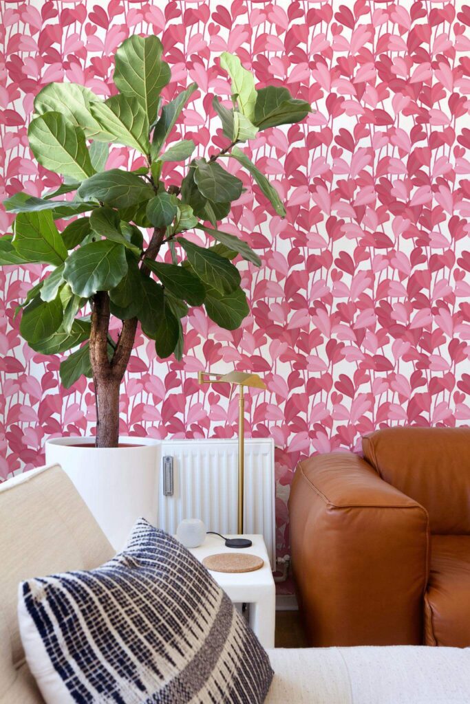 Picture of corner with pink leafy wallpaper. 