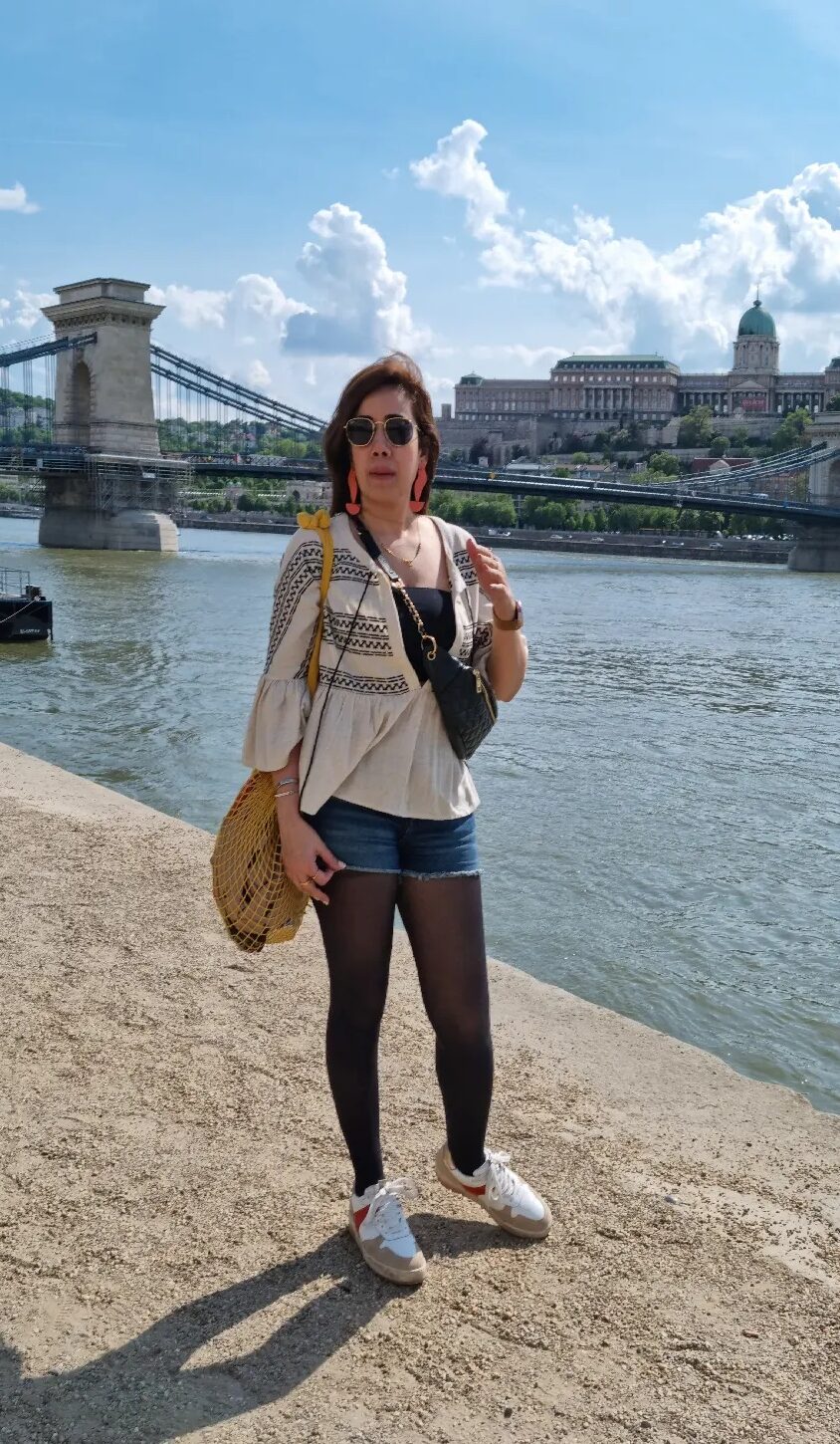 Picture of a girl standing at Danube river bank.