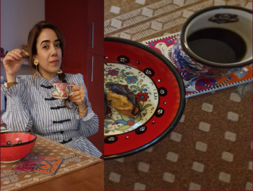 Picture of the author with a coffee cup and a little snack in hand.