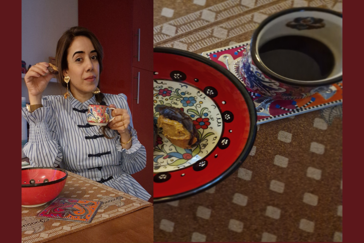 Picture of the author with a coffee cup and a little snack in hand.